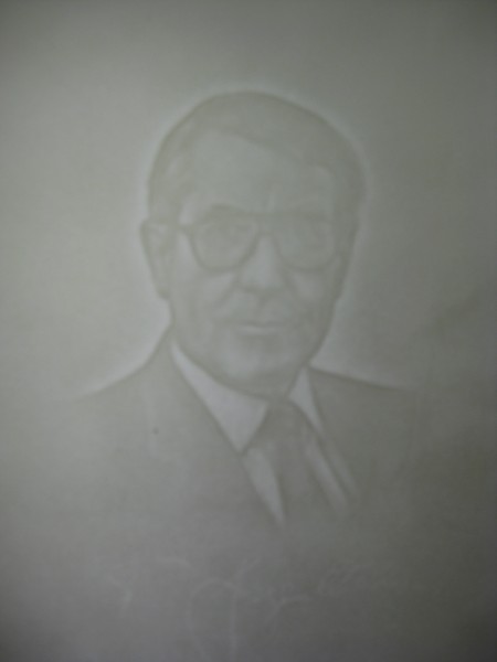 A chiaroscuro watermark of Fred Siegenthaler