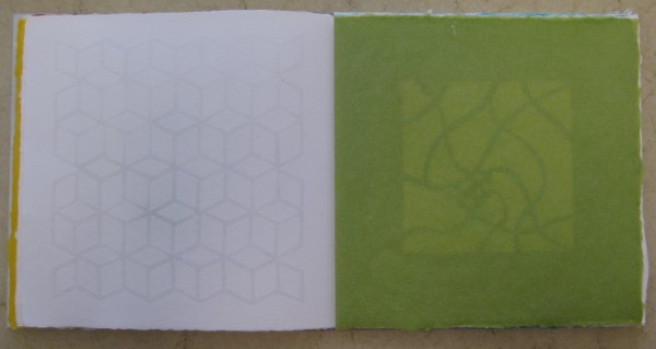 Back of watermark, with a glimpse of Beatrice Coron's paper cut through translucent green abaca.