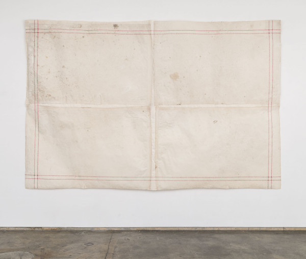 Elena del Rivero, “[Sw:t] Home dishcloth” (2001), stitches and mending on handmade and dirtie
d abaca paper with watermark, 77 x 117 inches