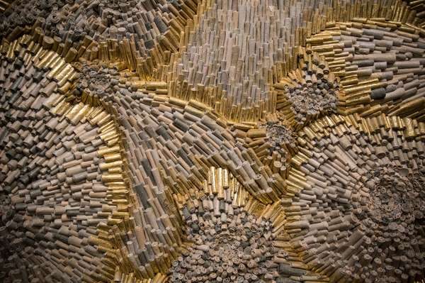 Detail of Jenn Hassin’s “A Battle Lost,” an installation created from handmade paper made of military uniforms.