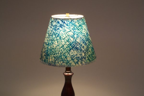 Wraparound lampshade featuring Nepalese lokta paper.