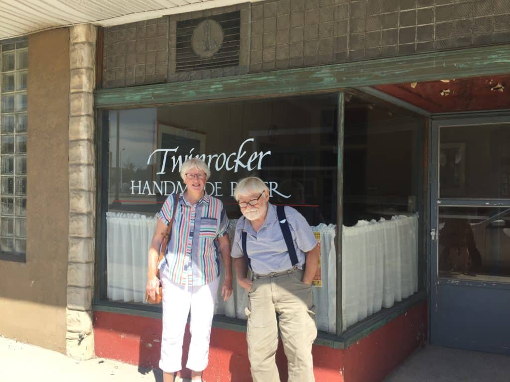 Howard & Kathryn Clark founded Twinrocker Handmade Paper, a legendary papermaking studio in Brookston, Indiana, in 1971. We talk about how the two of them met in graduate school at Wayne State University in Detroit cleaning silkscreens, (how sweet) and how they were introduced to papermaking by Aris Katroulis, a Tamarind trained printer who was exposed to paper by Laurence Barker, who was also in Detroit teaching at Cranbook. Kathy says she thought there were papermaking studios everywhere, since there were two in Detroit! After Grad school, they moved to San Francisco, where Kathy was the first woman to print at a Tamarind offshoot shop in San Francisco. Howard, who studied mechanical engineering and industrial design started building equipment and Twinrocker was born. Eventually, the couple moved to Brookston, Indiana to a family farm and the business grew over time, creating some of the finest papers in America, collaborating with numerous artists and selling papermaking supplies. Howie tells me how one of their key mentors in developing fine papers (because they were some of the few doing this at the time) was old books and old prints – they learned a lot from the paper in old books.